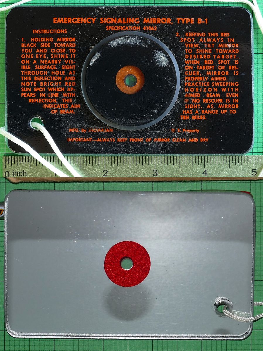 The front and back of an issue signal mirror with printed instructions