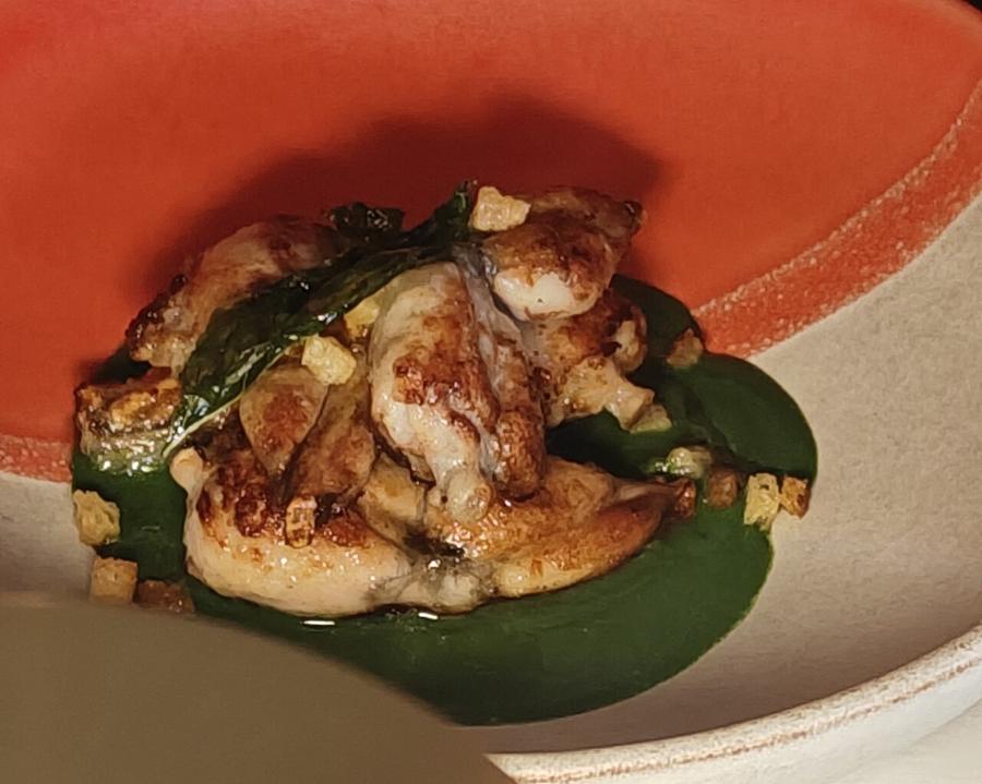 A plate of roasted frog legs
