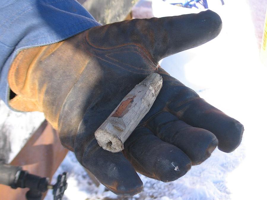 A homemade wooden spout for tapping a tree